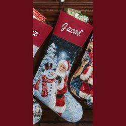 Santa Builds a Snowman Tapestry Stocking Red